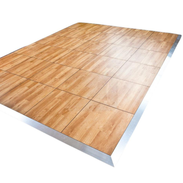 Folding dance floor in oak shade with frame in silver colour in furnished interior.